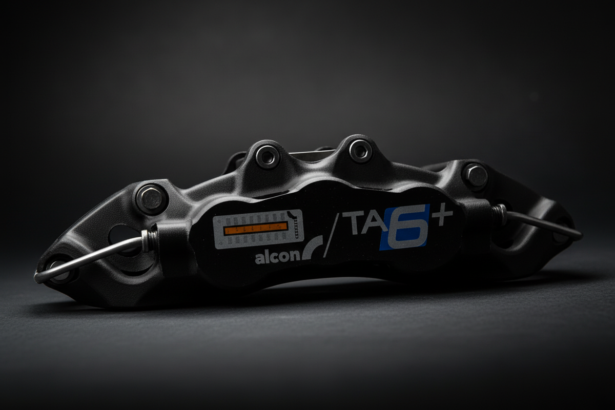 Alcon TA6+ caliper detail dark background