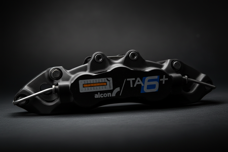 Alcon TA6+ caliper detail dark background