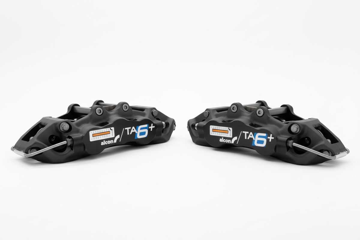 Two Alcon TA6+ callipers - bright white background