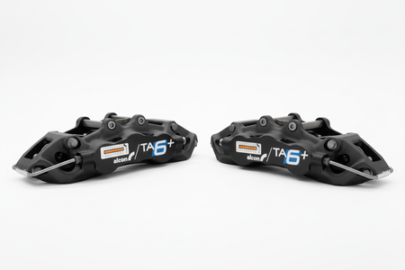 Two Alcon TA6+ callipers - bright white background